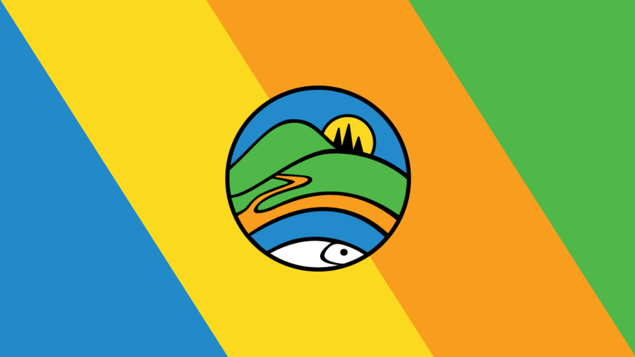 Farm at sunset with flowers in the foreground.